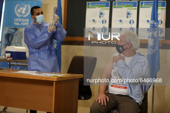 Matthias Schmale, UNRWA's Gaza director, receives a vaccine against the coronavirus disease (COVID-19) at a United Nations-run clinic in Gaz...