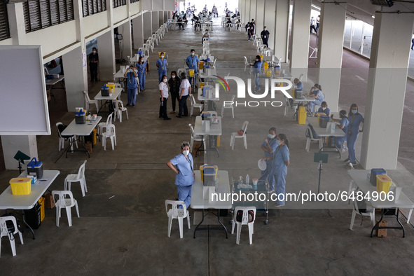 Nurses wait for hospital workers who are scheduled to receive the Sinovac COVID19 vaccine during a ceremonial vaccination program held insid...