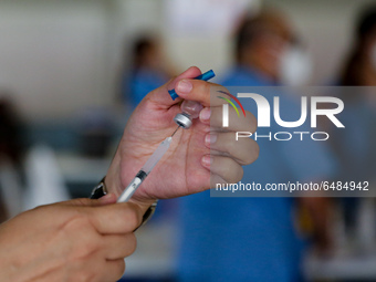 A nurse prepares to administer the Sinovac COVID19 vaccine during a ceremonial vaccination program held inside a sports stadium in Marikina...