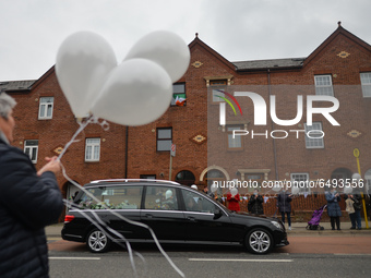 Residents of New Street in Dublin hold white balloons to say goodbye to their recently departed neighbour, Mrs. Quinn (age 89).
Since the be...