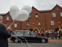 Residents of New Street in Dublin hold white balloons to say goodbye to their recently departed neighbour, Mrs. Quinn (age 89).
Since the be...