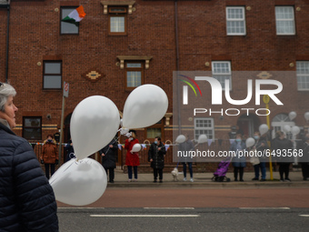 Residents of New Street in Dublin hold white balloons to say goodbye to their recently departed neighbour, Mrs. Quinn (age 89). 
Since the b...