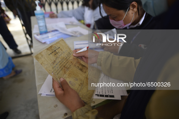 A Health worker arrange the list of the Nepalese People above 65 to gets first dose of COVID19 vaccines developed by Oxford- AstraZeneca Plc...