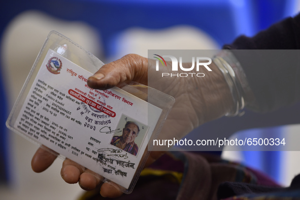 A Nepalese People above 65 shows social security card for verification before getting first dose of COVID19 vaccines developed by Oxford- As...