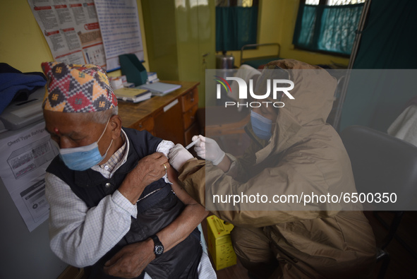 Nepalese People above 65 gets first dose of COVID19 vaccines developed by Oxford- AstraZeneca Plc at Bal Kumari Health Post, Kirtipur, Kathm...