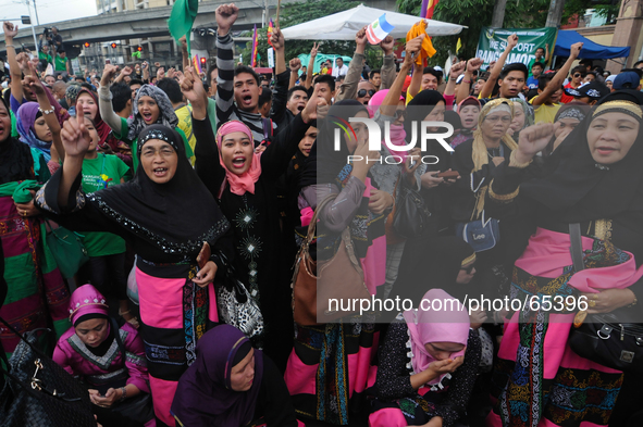 MANILA, Philippines - Filipino Muslims take part in a rally as they celebrate in Mendiola bridge in San Miguel, Manila on 27 March 2014. Phi...