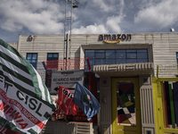 Members of the CISL, CGIL, UIL trade unions and some non-parliamentary party members gather outside the Amazon plant in Arzano in Naples, It...