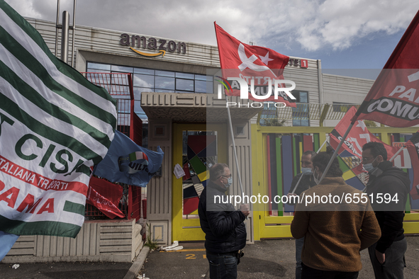 Members of the CISL, CGIL, UIL trade unions and some non-parliamentary party members gather outside the Amazon plant in Arzano in Naples, It...