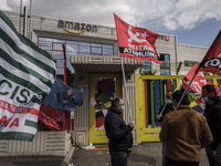 Members of the CISL, CGIL, UIL trade unions and some non-parliamentary party members gather outside the Amazon plant in Arzano in Naples, It...