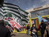 Members of the CISL, CGIL, UIL trade unions and some non-parliamentary party members gather outside the Amazon plant in Arzano in Naples, It...