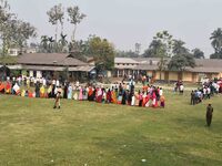 oters wait in queue to cast their ballots at a polling station during Phase 1 of Assam's legislative election in Nagaon district, in the nor...