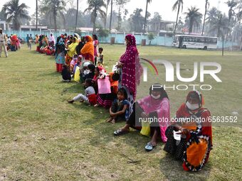 oters wait in queue to cast their ballots at a polling station during Phase 1 of Assam's legislative election in Nagaon district, in the nor...