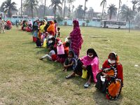 oters wait in queue to cast their ballots at a polling station during Phase 1 of Assam's legislative election in Nagaon district, in the nor...