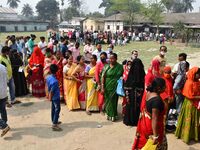 oters wait in queue to cast their ballots at a polling station during Phase 1 of Assam's legislative election in Nagaon district, in the nor...