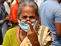 Woman voters hold up inked fingers after casting ballot  in the first  phase of polling for Assam Assembly Elections, at  Rupohi   constitue...