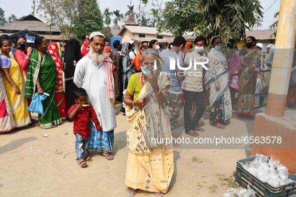 Woman voters hold up inked fingers after casting ballot  in the first  phase of polling for Assam Assembly Elections, at  Rupohi   constitue...