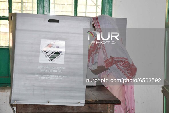 A  Women voters casting ballot  in the first  phase of polling for Assam Assembly Elections, at  Rupohi   constituency in Nagaon district, i...