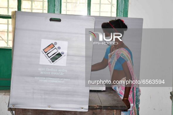 A  Women voters casting ballot  in the first  phase of polling for Assam Assembly Elections, at  Rupohi   constituency in Nagaon district, i...