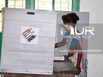 A  Women voters casting ballot  in the first  phase of polling for Assam Assembly Elections, at  Rupohi   constituency in Nagaon district, i...