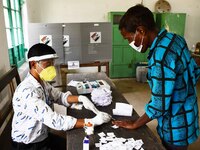 A voter's finger is inked while casting their ballot during first  phase polling  for Assam Assembly Elections, at Rupohi   constituency  in...