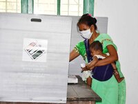 A  Women voters casting ballot  in the first  phase of polling for Assam Assembly Elections, at  Rupohi   constituency in Nagaon district, i...