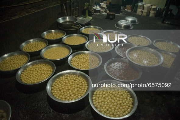 Sweets are kept in a traditional sweet production house in Bogura, Bangladesh. 