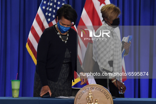 DC Mayor Muriel Bowser(left) and DC Director of Department of Health LaQuandra Nesbitt(right) arrive to hold a press conference about Covid1...