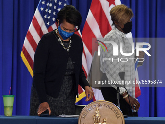 DC Mayor Muriel Bowser(left) and DC Director of Department of Health LaQuandra Nesbitt(right) arrive to hold a press conference about Covid1...
