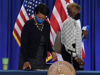 DC Mayor Muriel Bowser(left) and DC Director of Department of Health LaQuandra Nesbitt(right) arrive to hold a press conference about Covid1...