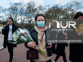 Mourners queue outside Buckingham Palace after it was announced that Britain's Prince Philip, husband of Queen Elizabeth, has died at the ag...