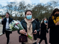 Mourners queue outside Buckingham Palace after it was announced that Britain's Prince Philip, husband of Queen Elizabeth, has died at the ag...