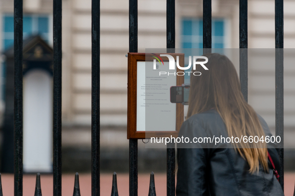 A member of the public looks at the official Royal announcement of the death of Prince Philip, Duke of Edinburgh is seen on the gates of Buc...