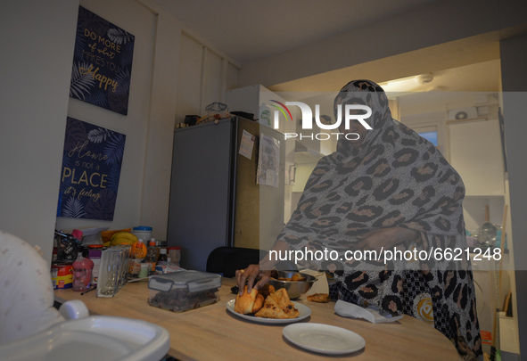 Ifrah Ahmed, a Somali-Irish living in Dublin, prepares her iftar (fast-breaking) dinner inside her apartment, on the second day of Ramadan,...