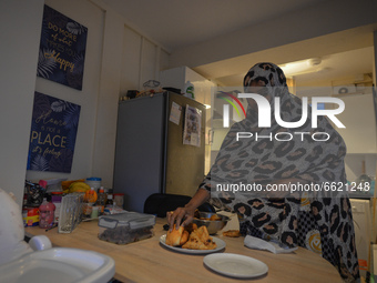 Ifrah Ahmed, a Somali-Irish living in Dublin, prepares her iftar (fast-breaking) dinner inside her apartment, on the second day of Ramadan,...