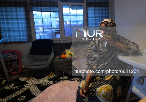 Ifrah Ahmed, a Somali-Irish living in Dublin, having a glass of water at the end of a fast inside her apartment, on the second day of Ramada...