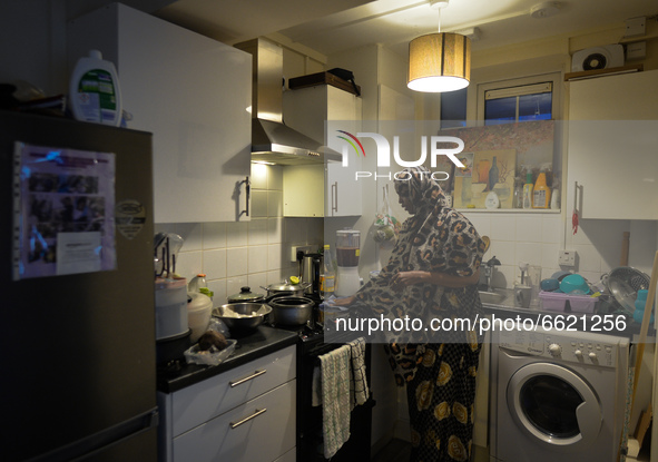 Ifrah Ahmed, a Somali-Irish living in Dublin, cleans her kitchen area after finishing preparing her iftar (fast-breaking) dinner inside her...