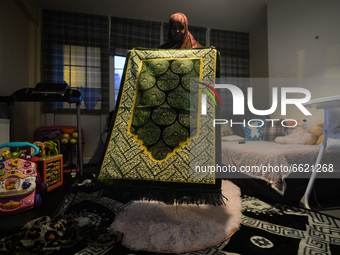 Ifrah Ahmed, a Somali-Irish living in Dublin, prepares a prayer mat for Maghrib, the fourth of the five required daily prayers, inside her a...