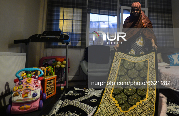 Ifrah Ahmed, a Somali-Irish living in Dublin, prepares a prayer mat for Maghrib, the fourth of the five required daily prayers, inside her a...