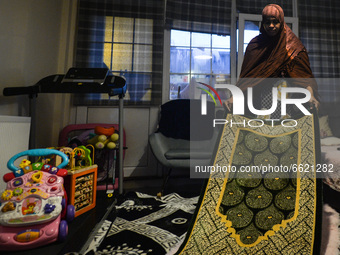 Ifrah Ahmed, a Somali-Irish living in Dublin, prepares a prayer mat for Maghrib, the fourth of the five required daily prayers, inside her a...