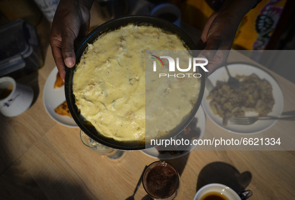 Ifrah Ahmed, a Somali-Irish living in Dublin, prepares the main meal after finishing Maghrib prayer, inside her apartment on the second day...