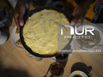 Ifrah Ahmed, a Somali-Irish living in Dublin, prepares the main meal after finishing Maghrib prayer, inside her apartment on the second day...