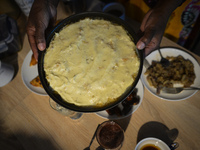 Ifrah Ahmed, a Somali-Irish living in Dublin, prepares the main meal after finishing Maghrib prayer, inside her apartment on the second day...