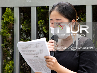 Lim Ji-young, an activist of ADI(Asian Dignity Initiative) shedds tears during solidarity remarks outside of Indonesian Embassy in Korea on...