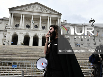 A student using a megaphone encourages the demonstrators in front of the Republic Assembly palace. April 28, 2021. Demonstrators from differ...