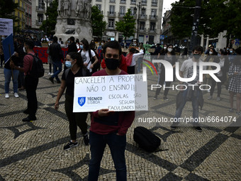 Students wearing protective masks march through the streets of Lisbon to demand their rights as students. April 28, 2021. Demonstrators from...