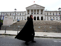 A student using a megaphone encourages the demonstrators in front of the Republic Assembly palace. April 28, 2021. Demonstrators from differ...