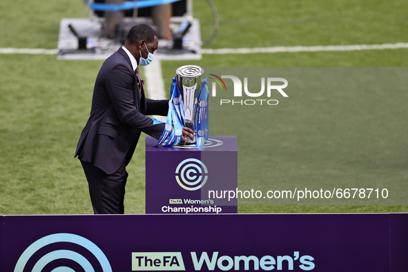  Emile Heskey places the womens Championship trophy on the stand after the FA Women's Championship match between Leicester City and Charlton...