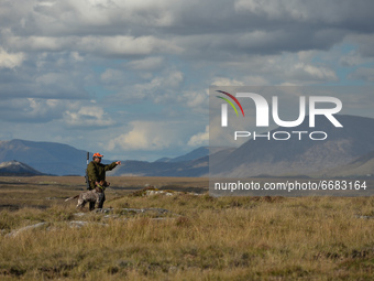 Father Krzysztof Sikora seen with his dog 'Rambo' near to the Gowla Fishery, situated in central Connemara, among one of the most beautiful...