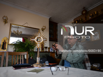 Father Krzysztof Sikora checks the liturgical vessels used during the celebration of the Holy Mass inside the presbytery in Roundstone.

Geo...