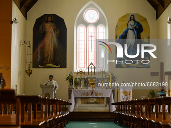 Father Krzysztof Sikora during a private prayer at the closed and empty Roman Catholic Church 'Our Lady Star Of The Sea' in Roundstone. Due...